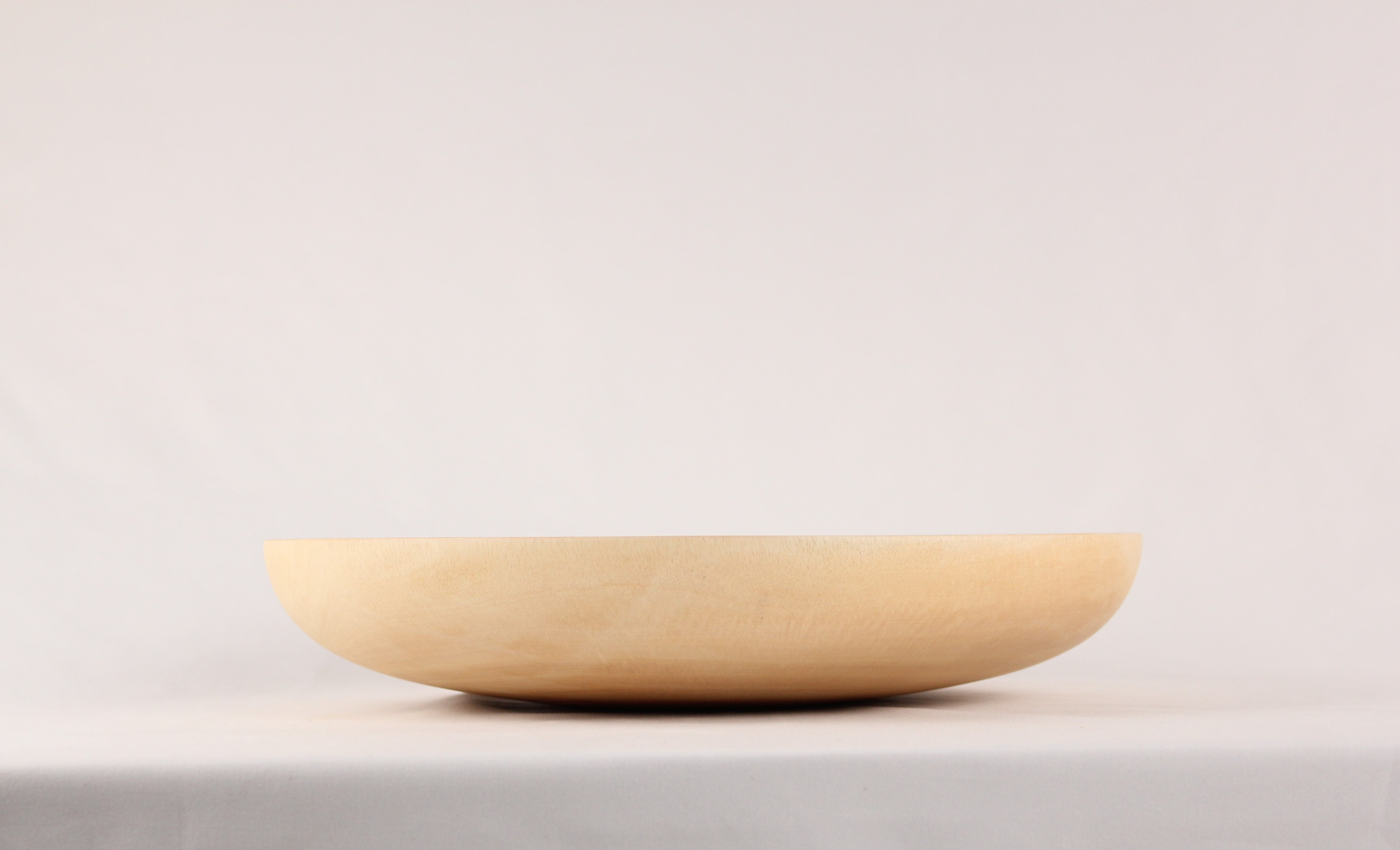 Side view of a mango wood plate