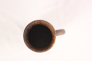 Top-down view of a sugar palm wood mug